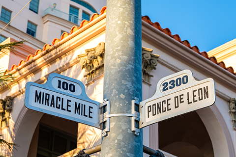 An up close image of street signs in Coral Gables, Florida.