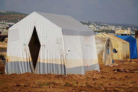 A stock photo of tents in a refugee camp.